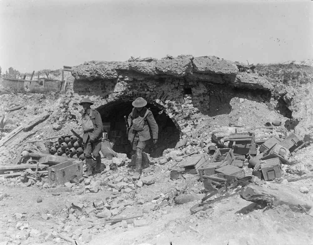 Two New Zealand soldiers leaving a damaged German ammunition dug-out. Achiet-le-Petit, Battle of Albert, 21 August 1918.